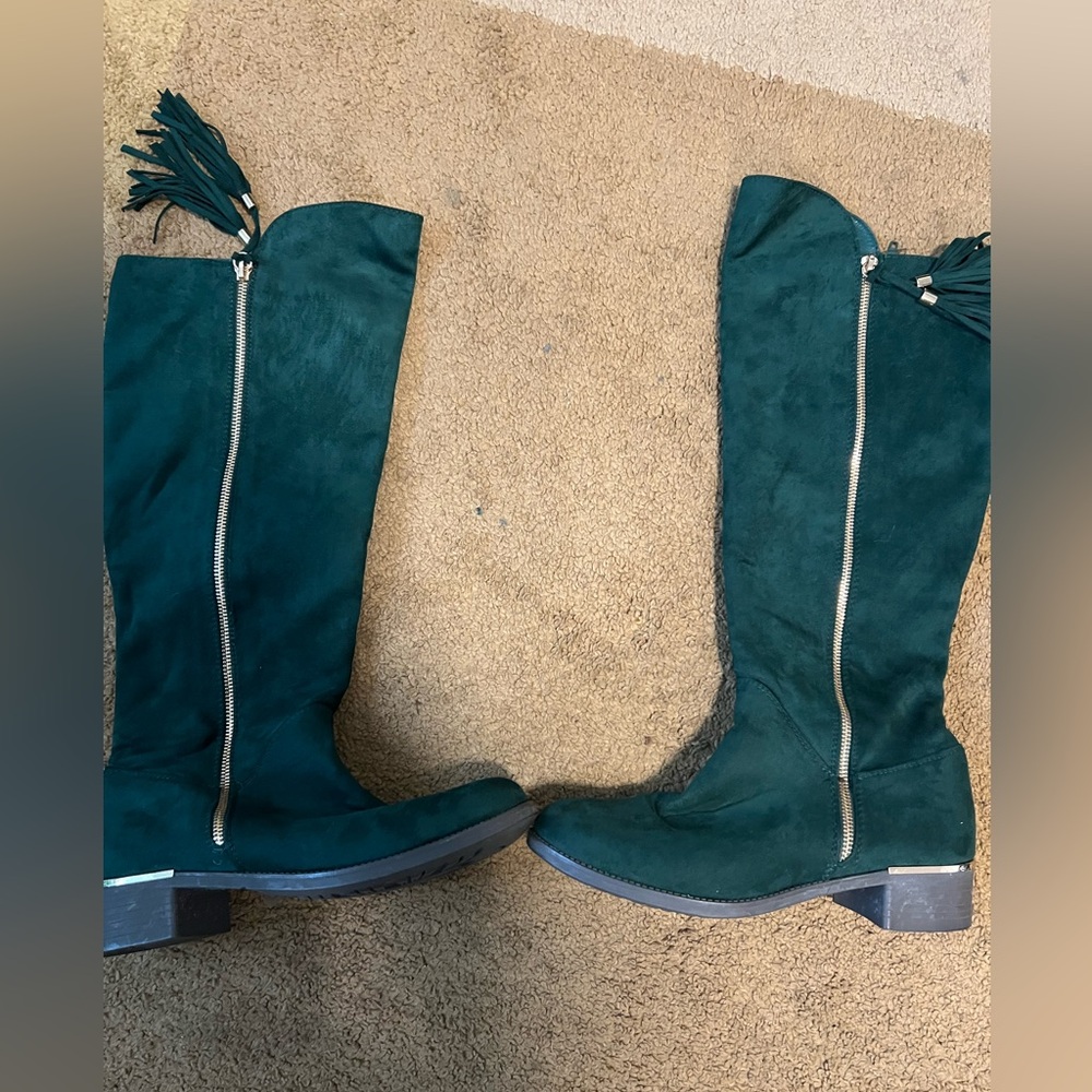 Green knee high boots.